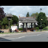 A thatched bus stop and bird house in Westcott.