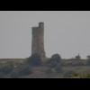 This older tower stands on a little mound like the Emley Moor tower, and is a similar colour. I wond...