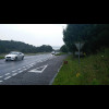 A large hill on a busy road in the rain. There would be no more major hills after this today but the...