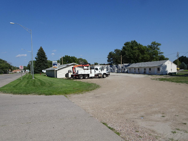 Here's my motel, with one of the vehicles which can drive on rails parked outside. It's right opposi...