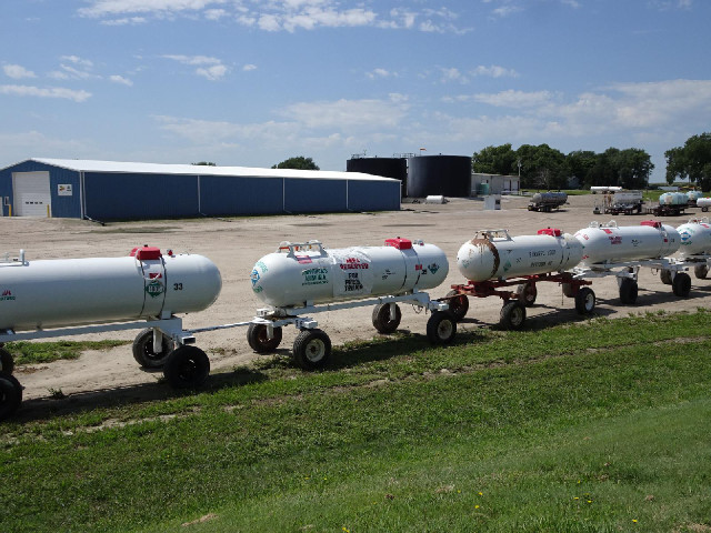 Here, all the anhydrous ammonia tanks have been joined together to form a long train stretching righ...
