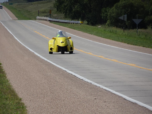 A slightly unusual vehicle. Later, I would be overtaken by a big motorised tricycle with two seats s...