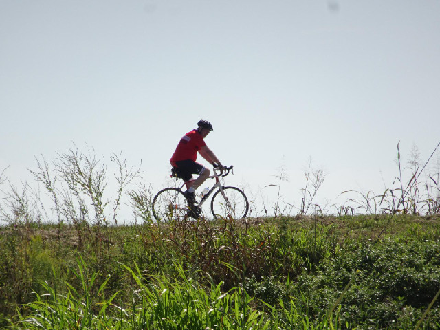 One of the cyclists.