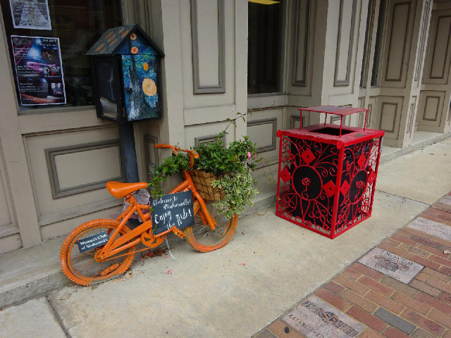 Central Madisonville has several bikes like this one and the bins all are in ornate containers.
