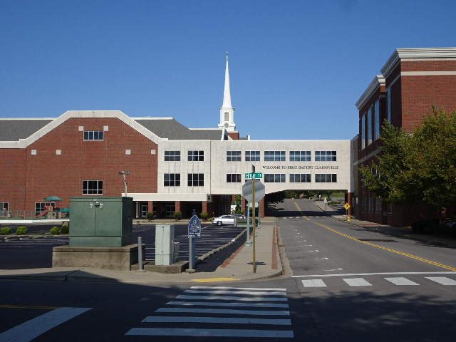 The building spanning the road is a church.