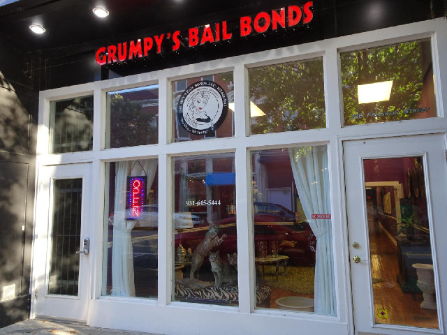This bail bond business looks a bit weird. Why does it have three stuffed wild cats in the window?
