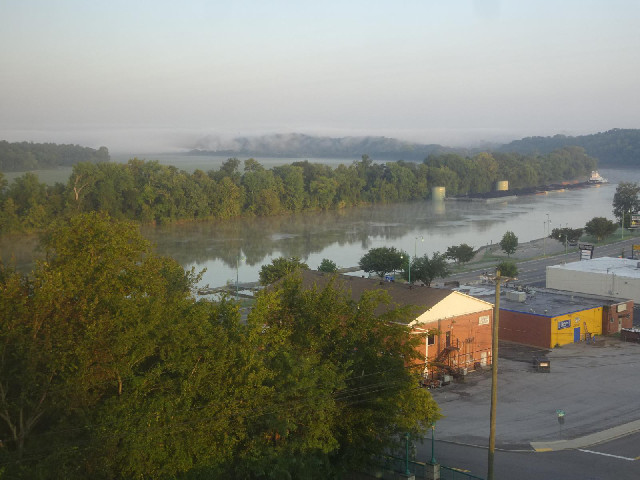 There's some mist sitting in the valley on the  other side of the river.
