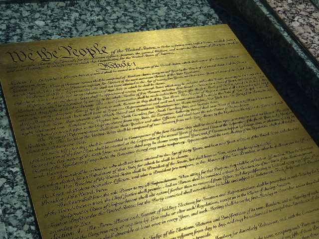 The first pages of a copy of the US Constitution in brass...