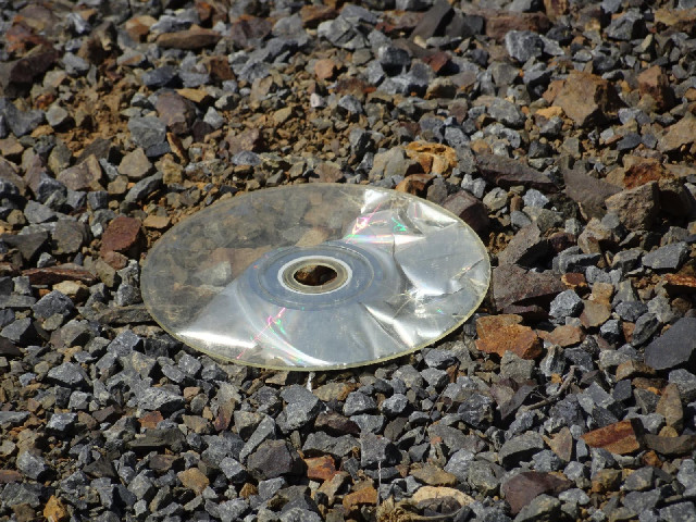 An old CD, undergoing weathering.