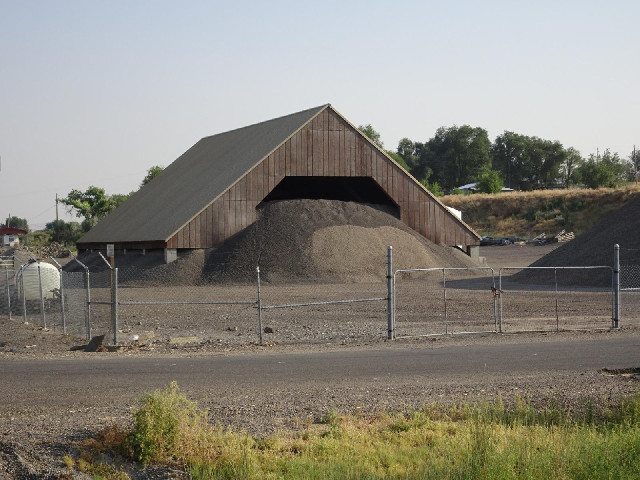 That barn isn't really big enough for that pile of gravel.