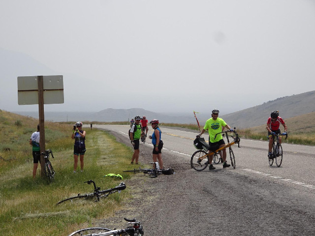 Cyclists posing at the top.