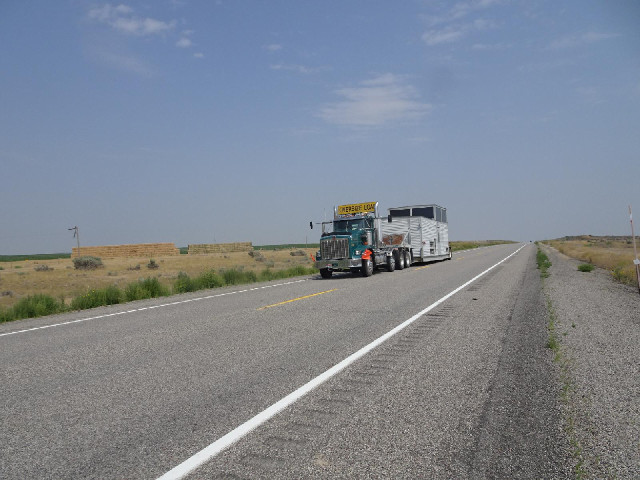 An oversize load. What I didn't get a picture of was one of the shiny Idaho National Laboratory coac...