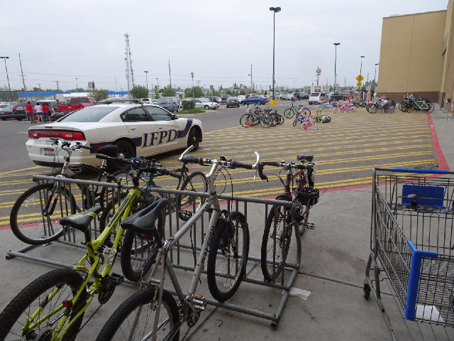 Wal-Mart's bike parking area is next to its display of bikes for sale.
