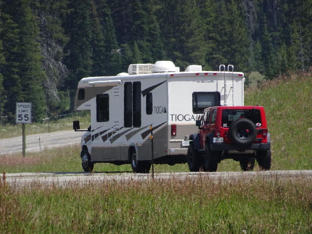 A camper van towing a car is quite a common sight around here. Sometimes the cars themselves are pre...