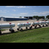 Here, all the anhydrous ammonia tanks have been joined together to form a long train stretching righ...