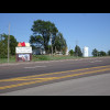 The sign calls Hiawatha "City of Beautiful Maples" and then boasts that it was the birthpl...