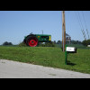 This farm has a pair of beautifully painted old tractors as gateposts.