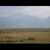 A scene with what look like some stacks of hay.