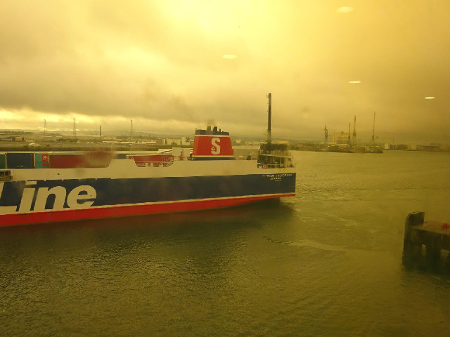 Another boat leaving Belfast, seen through a rather dirty window.