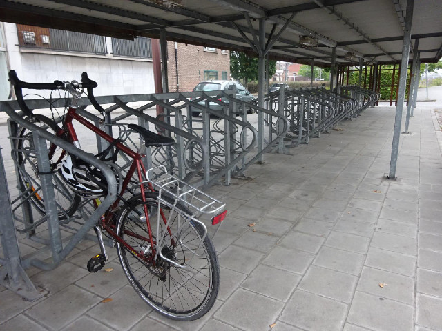 I've found an undercover bike rack, at the station about ten minutes' walk from the hotel. The rain ...