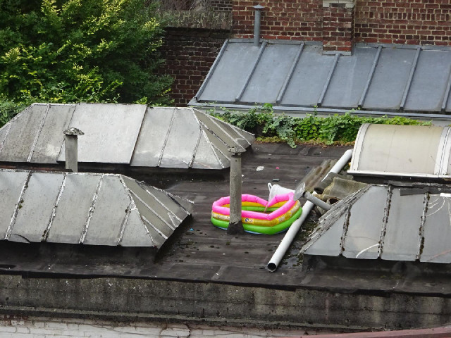 A paddling pool on a roof.