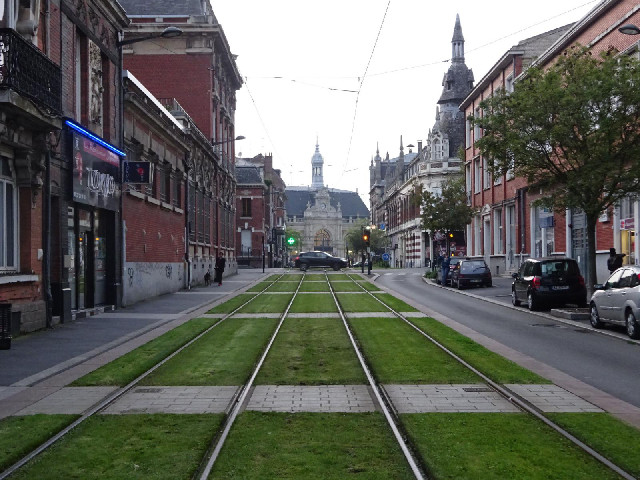 The tram lines also act as little green spaces. Also, I can't help noticing that it still isn't rain...