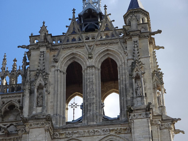 The cross visible through the archways is on the top of the main spire.