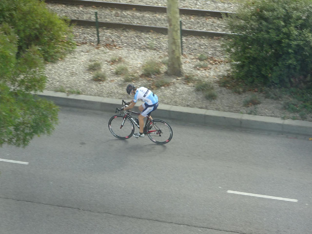 A cyclist, seen from my window.