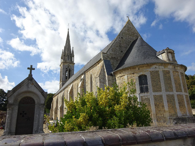 The church at Esquay-sur-Seulles. An information board here points out the sundial mounted on the to...