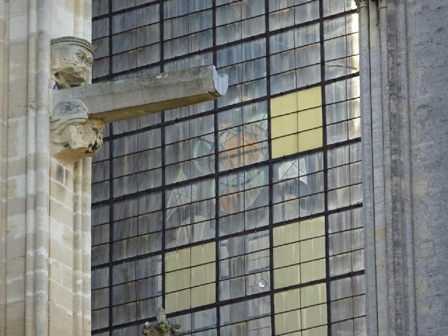 You can see through one window to a stained glass window on the other side of the transept.