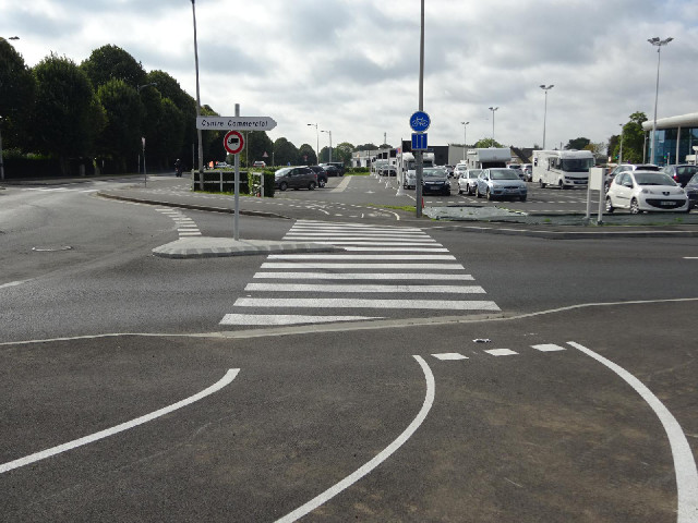 This cycle lane is badly designed. I was watching to see what traffic was coming round the roundabou...
