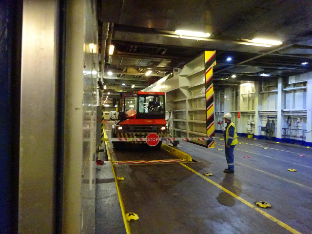 This is one of the vehicles used to shunt lorry trailers on and off the ship. The driver's seat swiv...