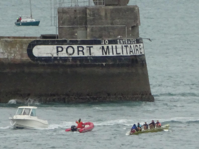 Some rowers in the harbour.