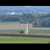 A monument, with part of Amiens in the distance.