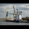 Grain being loaded on or off a boat in the Caen Canal. According to a ship tracking website, it will...