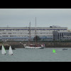 A tall ship entering the harbour.