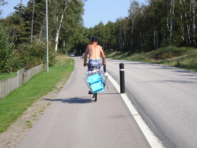 I followed this man and his deck chair for a couple of kilometres. He was going quite slowly but I'm...