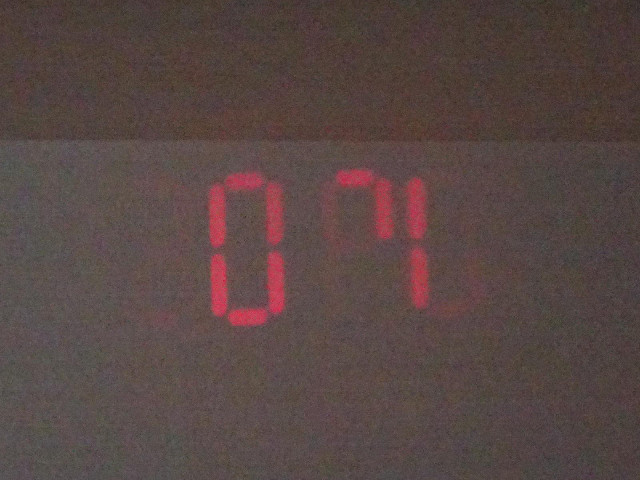 The clock in my room is trying to project the time onto the ceiling but it isn't doing very well. Th...