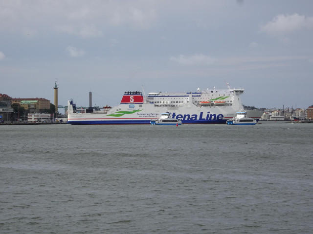 The ferry from Denmark arriving and turning in the river.