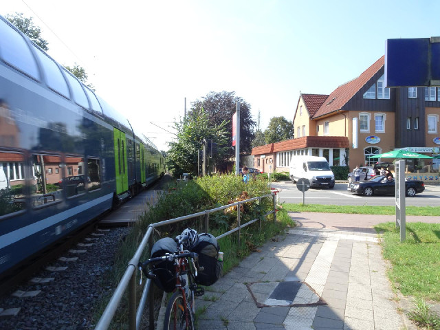 ... two trains to go through the level crossing.