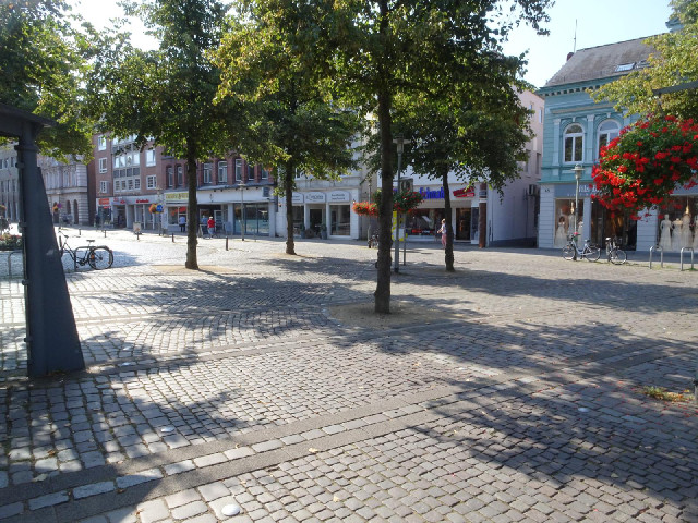 The bike lane has smaller cobbles than the rest of the pedestrianised area and its edges are marked ...