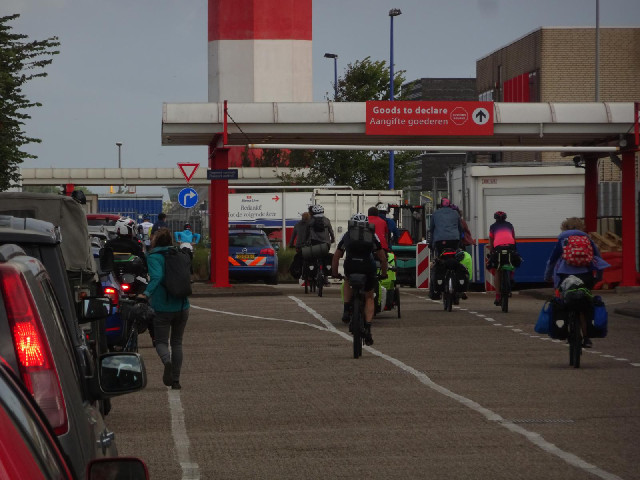 Some of the cyclists have found an extra passport checking lane which wasn't indicated by the signs.