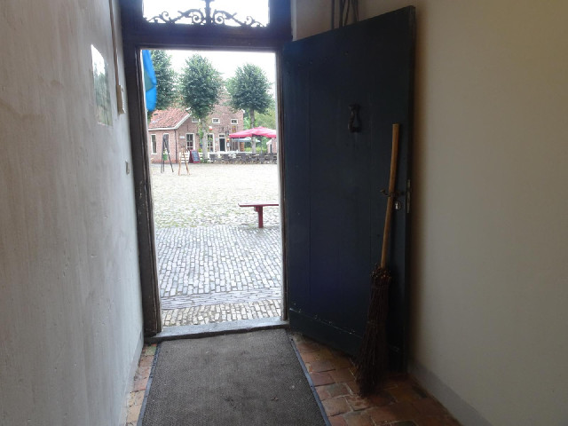 I like how the door is propped open by a broom.