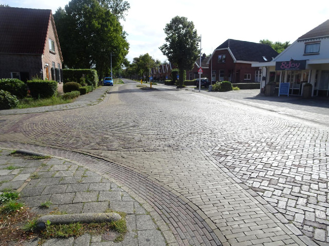 Dutch roundabouts are sometimes indicated just by the pattern of the cobbles. Sometimes, the centre ...