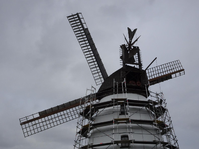 You can see some of the cog wheels inside the top of the windmill.