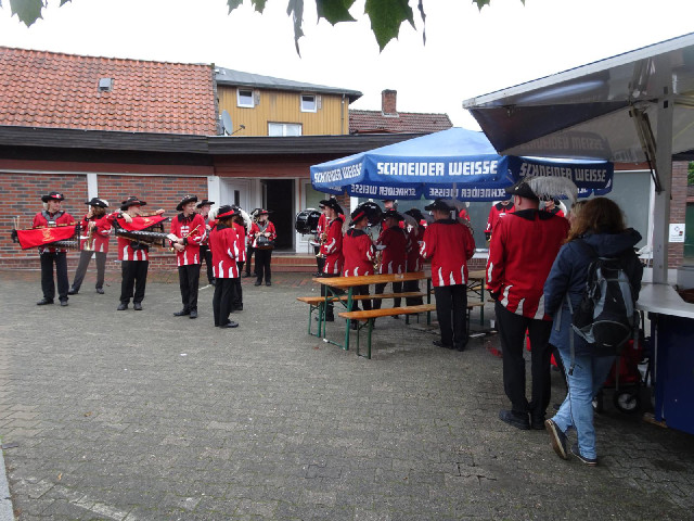 A marching band with at least two xylophones.