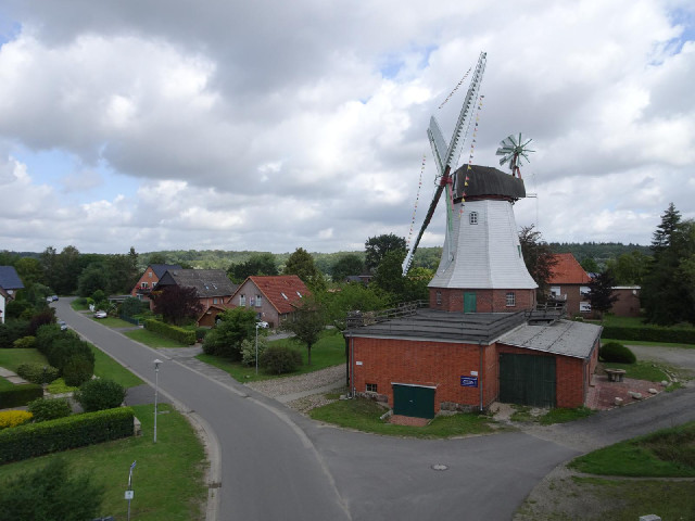 The windmill has bunting in the colours of the German flag.