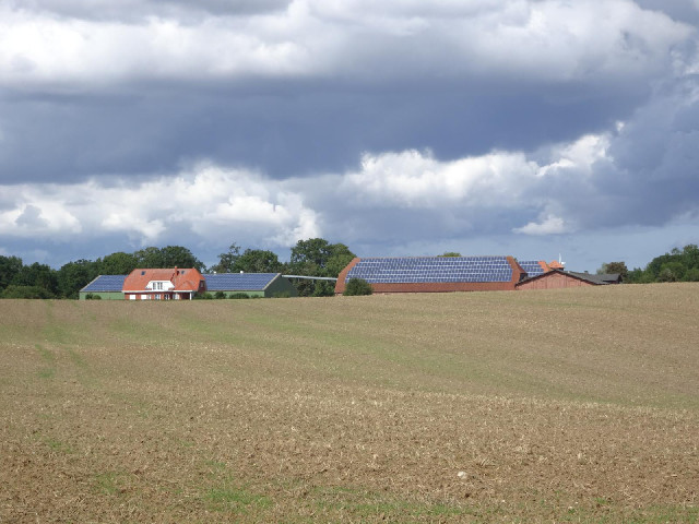 A farm with solar panels.