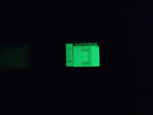 The fire evacuation diagram in my room glows in the dark. I think it's made out of something which a...