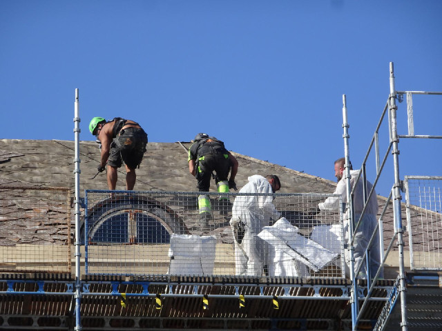 Workers on a roof.
